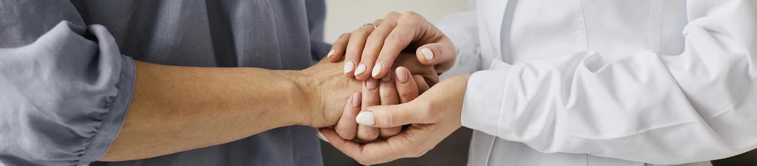 doctor holding a patient's hand