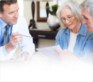 Doctor points to a document with elderly couple