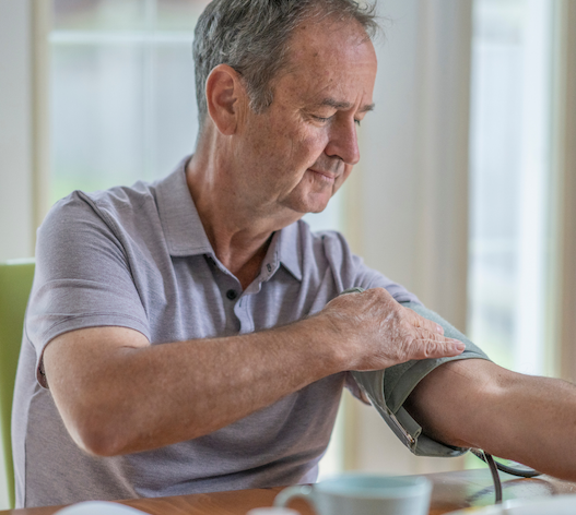man taking blood pressure man taking blood pressure