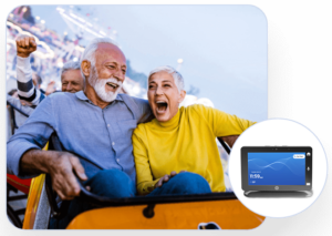 elderyl couple on a roller coaster smiling