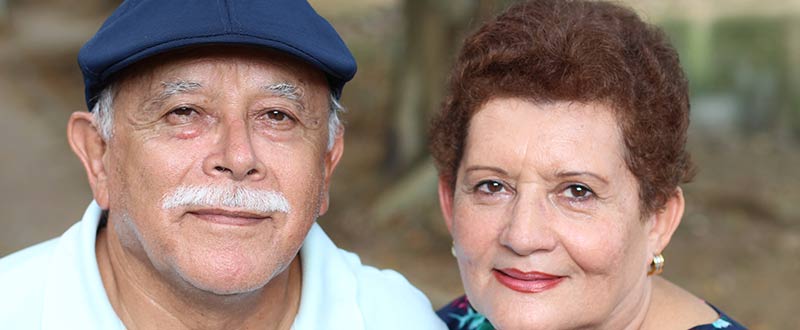 elderly couple gazing directly into camera