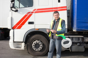 Man in safety vest holding a tablet using remote patient monitoring